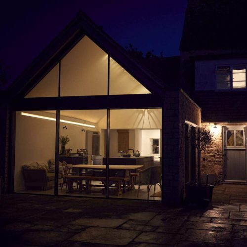 Exterior View Of Beautiful Kitchen Extension At Night